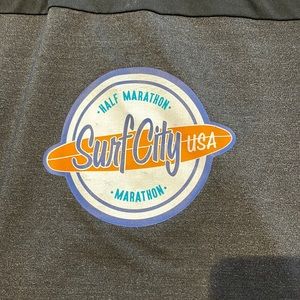 Surf city half marathon finisher jacket.